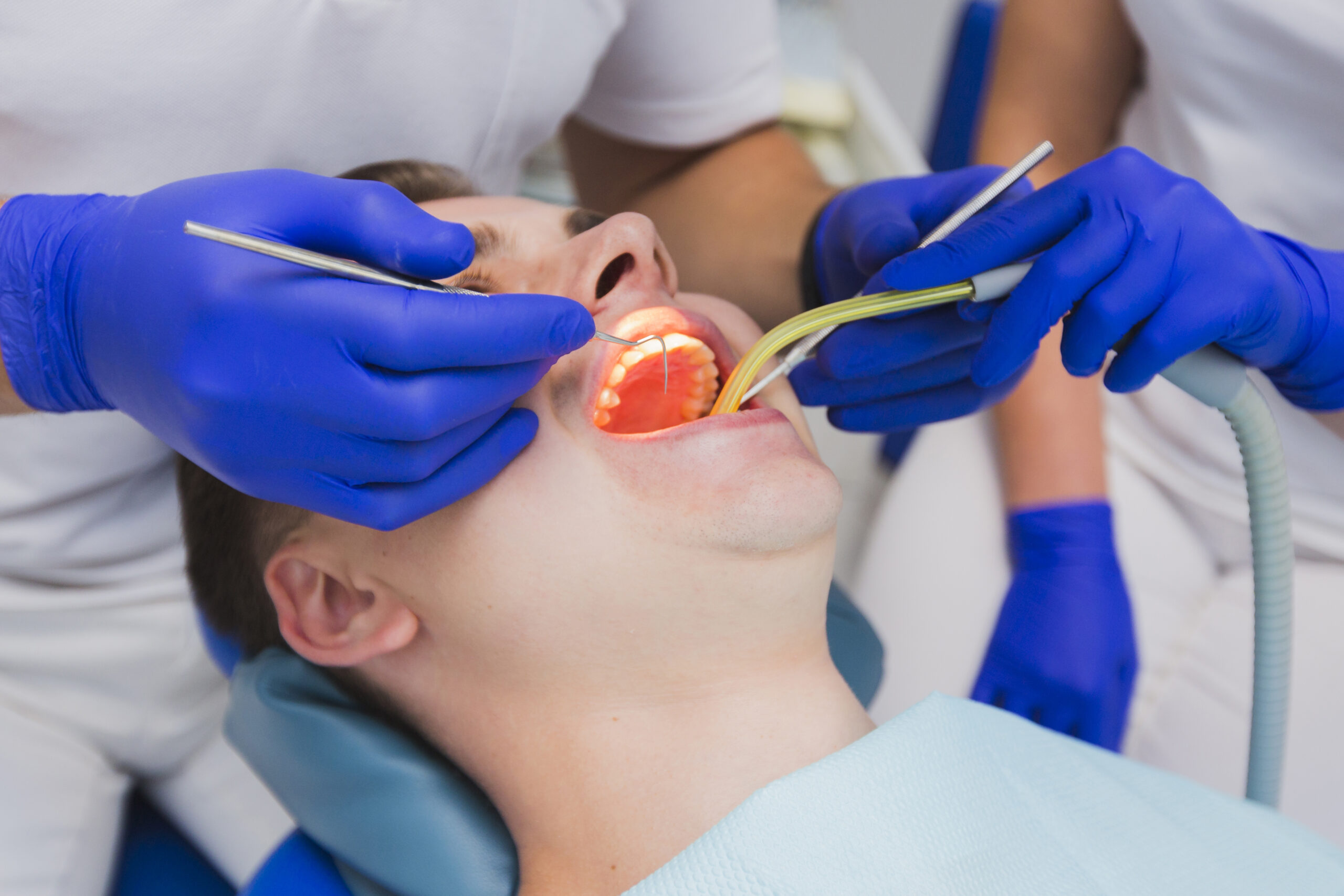 https://65broadwaydental.com/wp-content/uploads/2025/05/close-up-dental-procedure-patient-scaled-1.jpg
